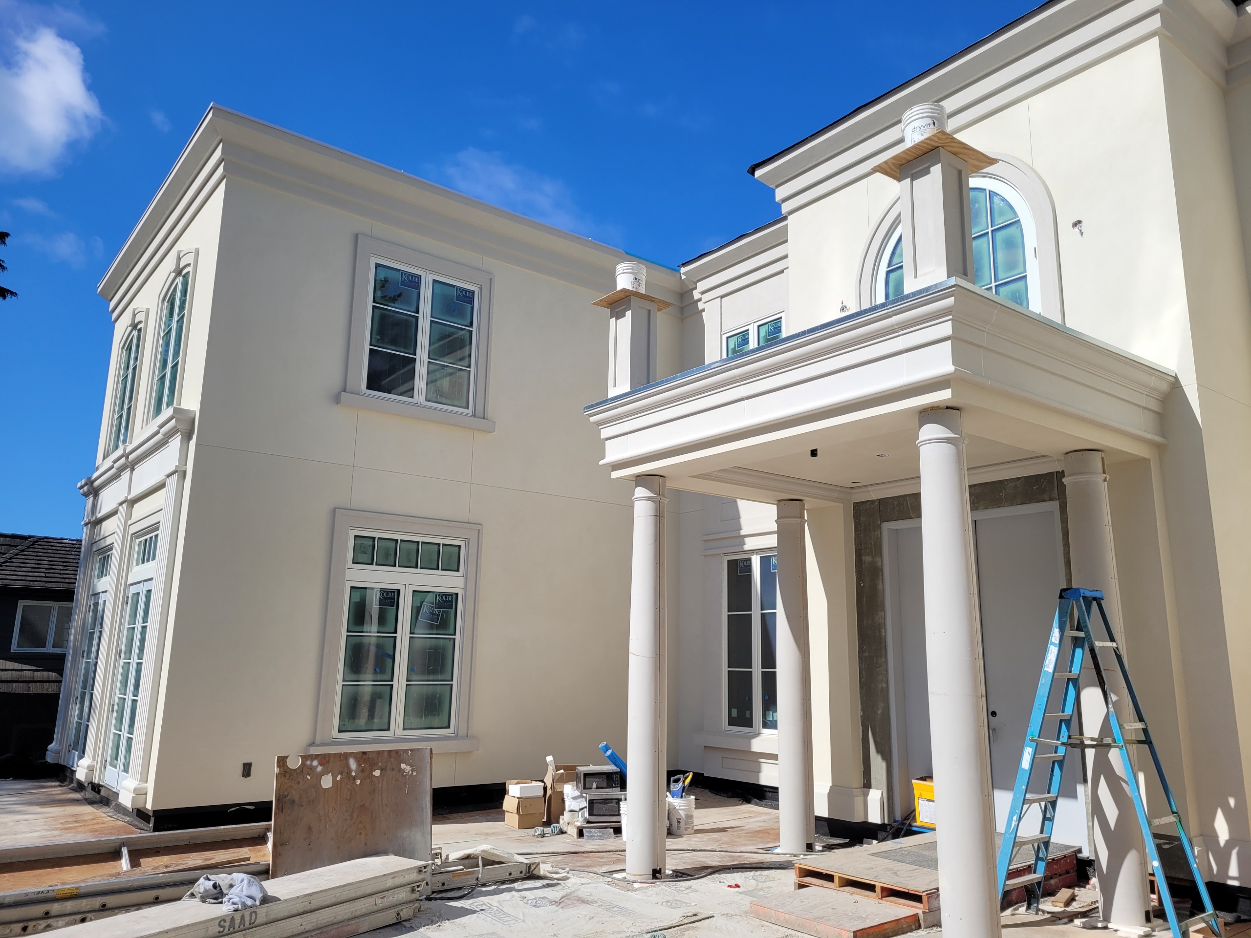 A professional stucco finish being applied by a skilled craftsman.